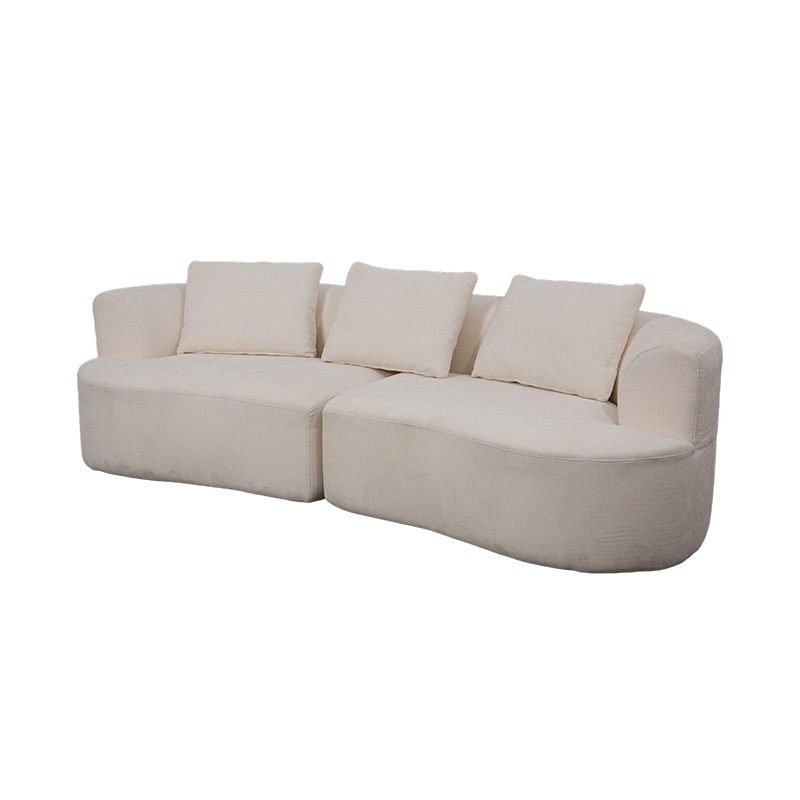 Canapé double modulable en velours crème avec coussins assortis et dossier incurvé Canapé double modulable en velours crème avec coussins assortis et dossier incurvé